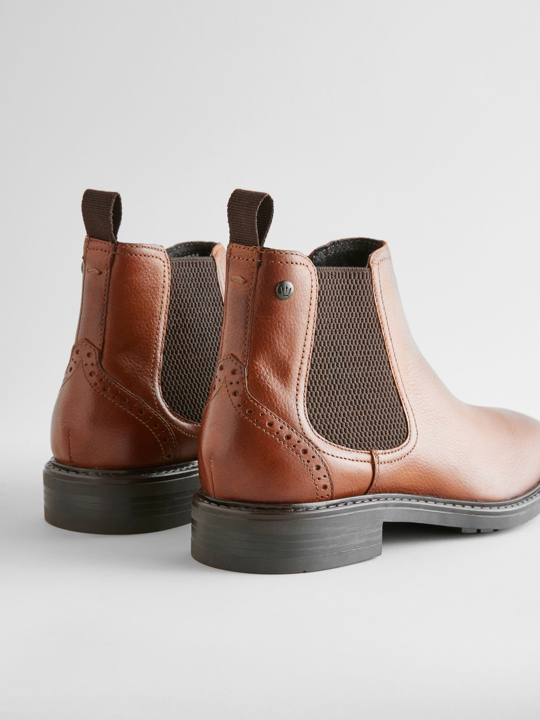 Tan coloured chelsea boots top