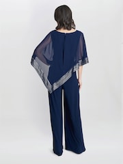 Gina Bacconi Eve Asymmetrical Cape Jumpsuit With Foil Trim - Imagen 2 de 5