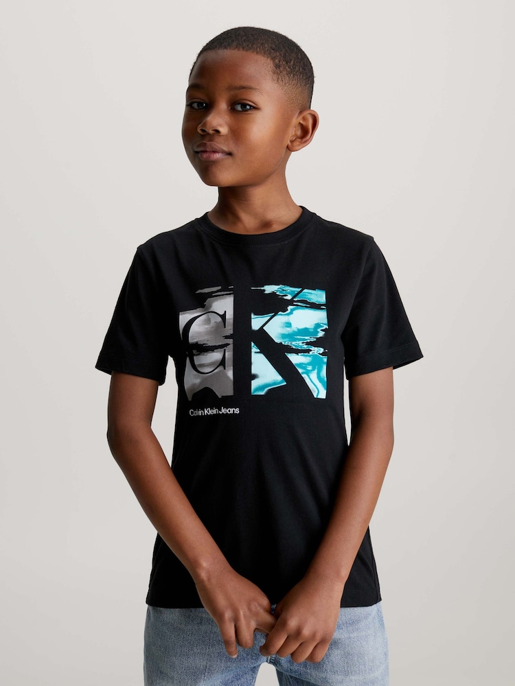 Calvin Klein Black 100% Cotton Graphic Logo T-Shirt - Image 1 of 6 Calvin Klein Black 100% Cotton Graphic Logo T-Shirt - Image 1 of 6