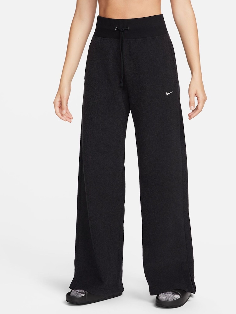 Nike Black Phoenix Plush High-Waisted Wide-Leg Cozy Fleece Joggers - Image 1 of 6 Nike Black Phoenix Plush High-Waisted Wide-Leg Cozy Fleece Joggers - Image 1 of 6