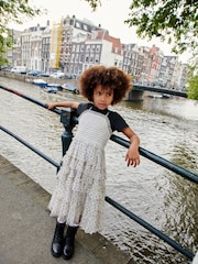 نقط بارزة لون أسود/أبيض - طقم مكون من تيشرت وفستان كامي من قماش شبكي (3-16سنة) - صورة 1 من 1