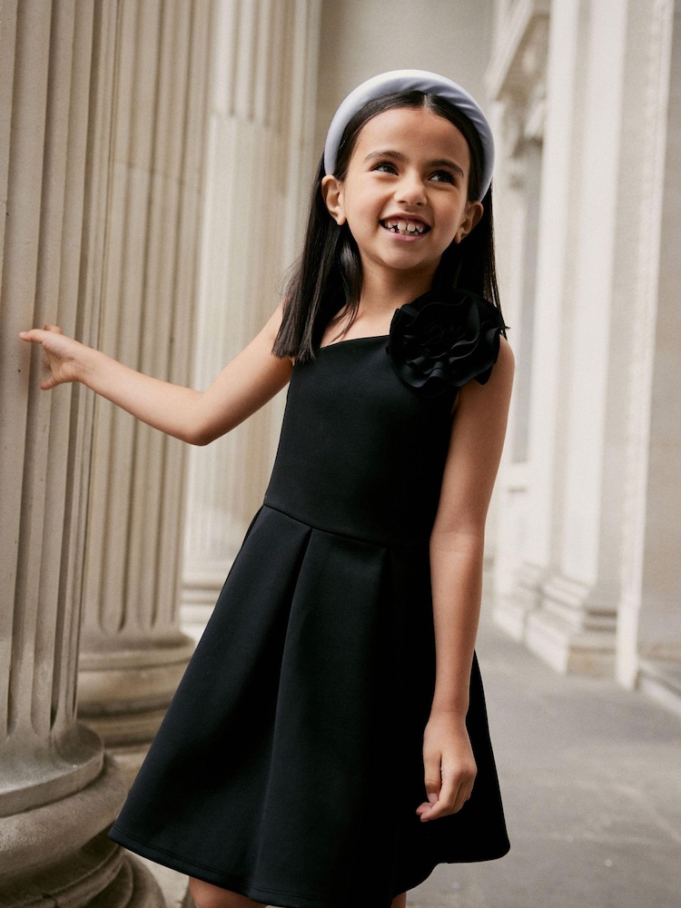 Black 3D Flower Corsage Asymmetric Scuba Occasion Dress (1.5-16yrs) - Image 1 of 6