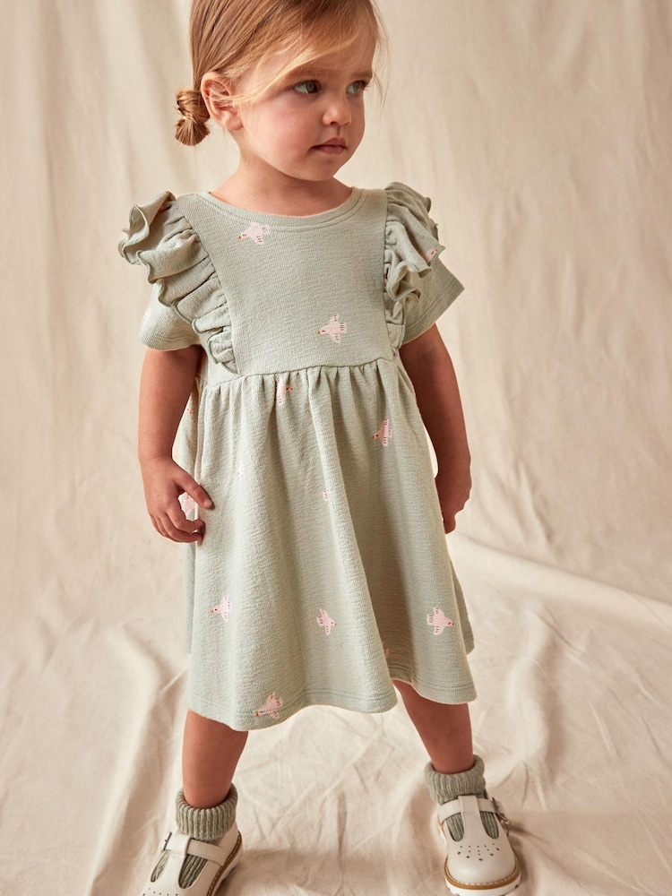 Grün - Kurzärmeliges, strukturiertes Kleid mit Rüschen (3Monate -7Jahre) - Bild 1 von 10 Grün - Kurzärmeliges, strukturiertes Kleid mit Rüschen (3Monate -7Jahre) - Bild 1 von 10