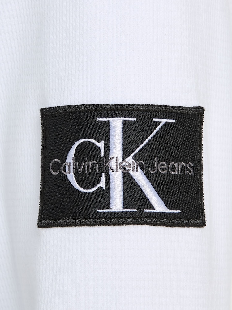 Calvin Klein Jeans Monogram Badge Waffle 100% Cotton Long Sleeve White T-Shirt - Image 6 of 6 Calvin Klein Jeans Monogram Badge Waffle 100% Cotton Long Sleeve White T-Shirt - Image 6 of 6