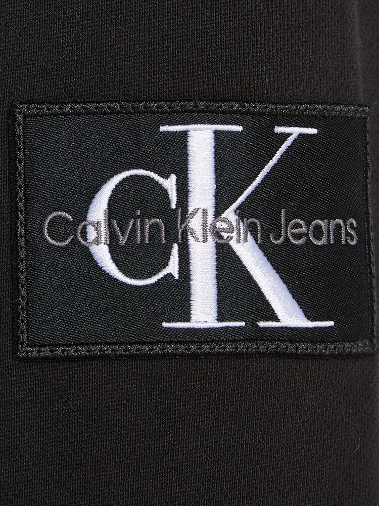 Calvin Klein Jeans Monogram Badge Logo 100% Cotton Crew Neck Black Sweatshirt - Image 6 of 6 Calvin Klein Jeans Monogram Badge Logo 100% Cotton Crew Neck Black Sweatshirt - Image 6 of 6