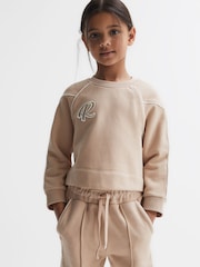 Reiss Camel Julia 4-9 yrs Embroidered Crew Neck Sweatshirt - Image 1 of 6