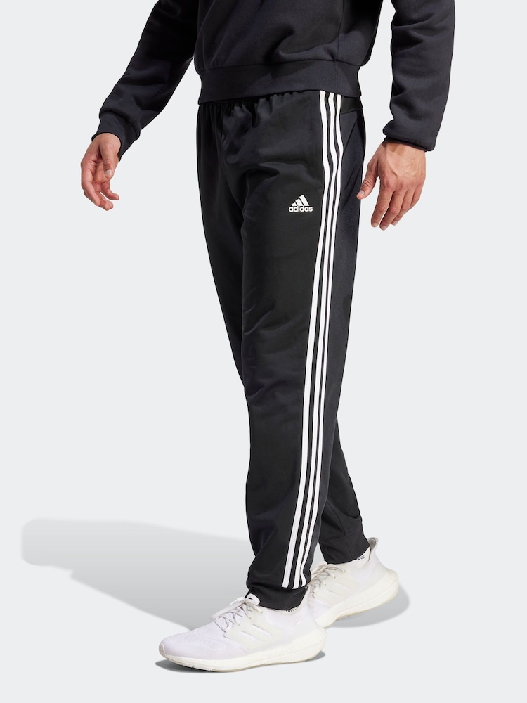أسود داكن - بنطلون رياضي أضيق من أسفل 3 خطوط من Adidas - صورة 1 من 6