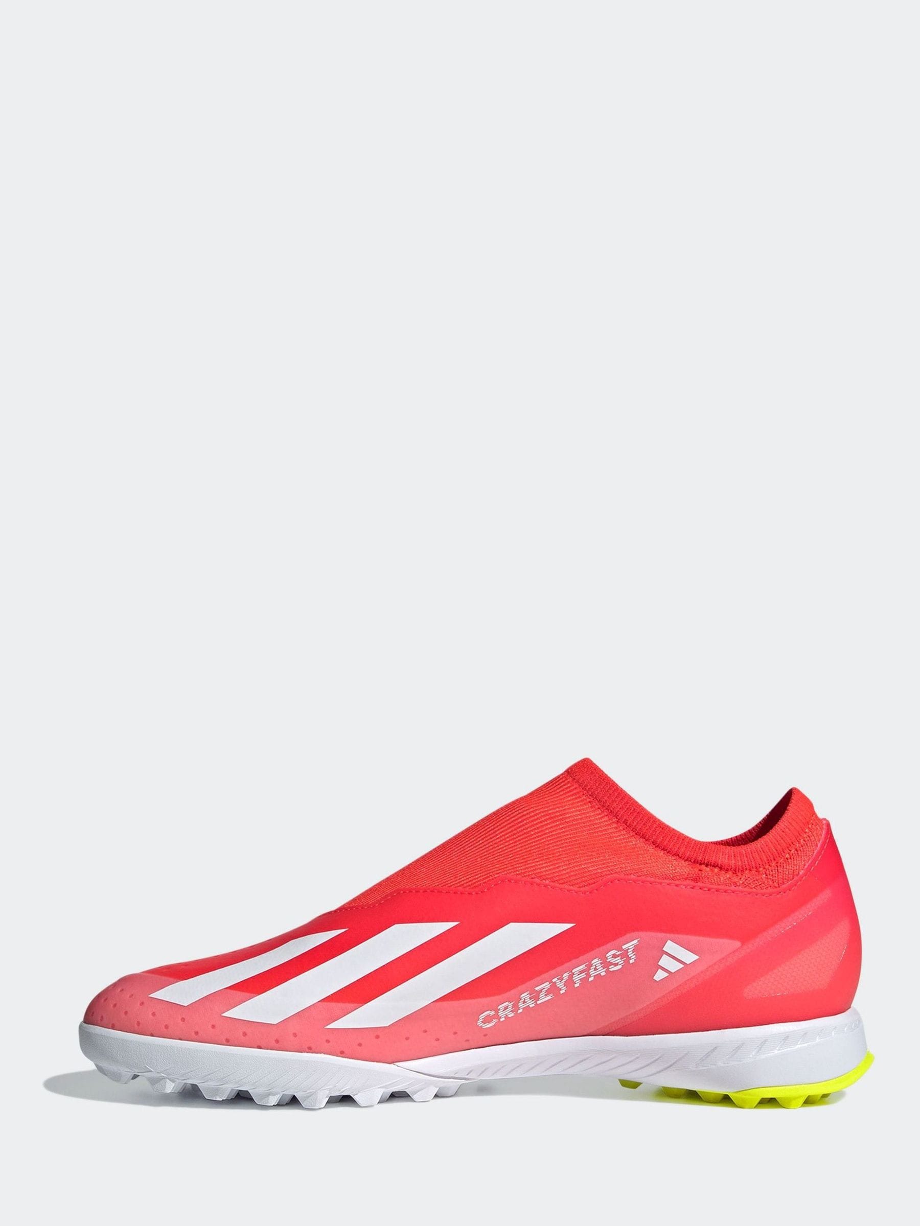 Red laceless football boots on sale