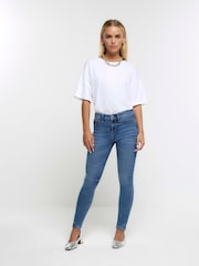 Azul claro - Vaqueros pitillo de efecto moldeador y tiro alto de River Island Petite - Imagen 1 de 5