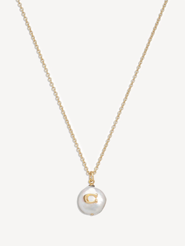 COACH Gold Tone Signature Coin Pearl Pendant Necklace - Image 1 of 3 COACH Gold Tone Signature Coin Pearl Pendant Necklace - Image 1 of 3