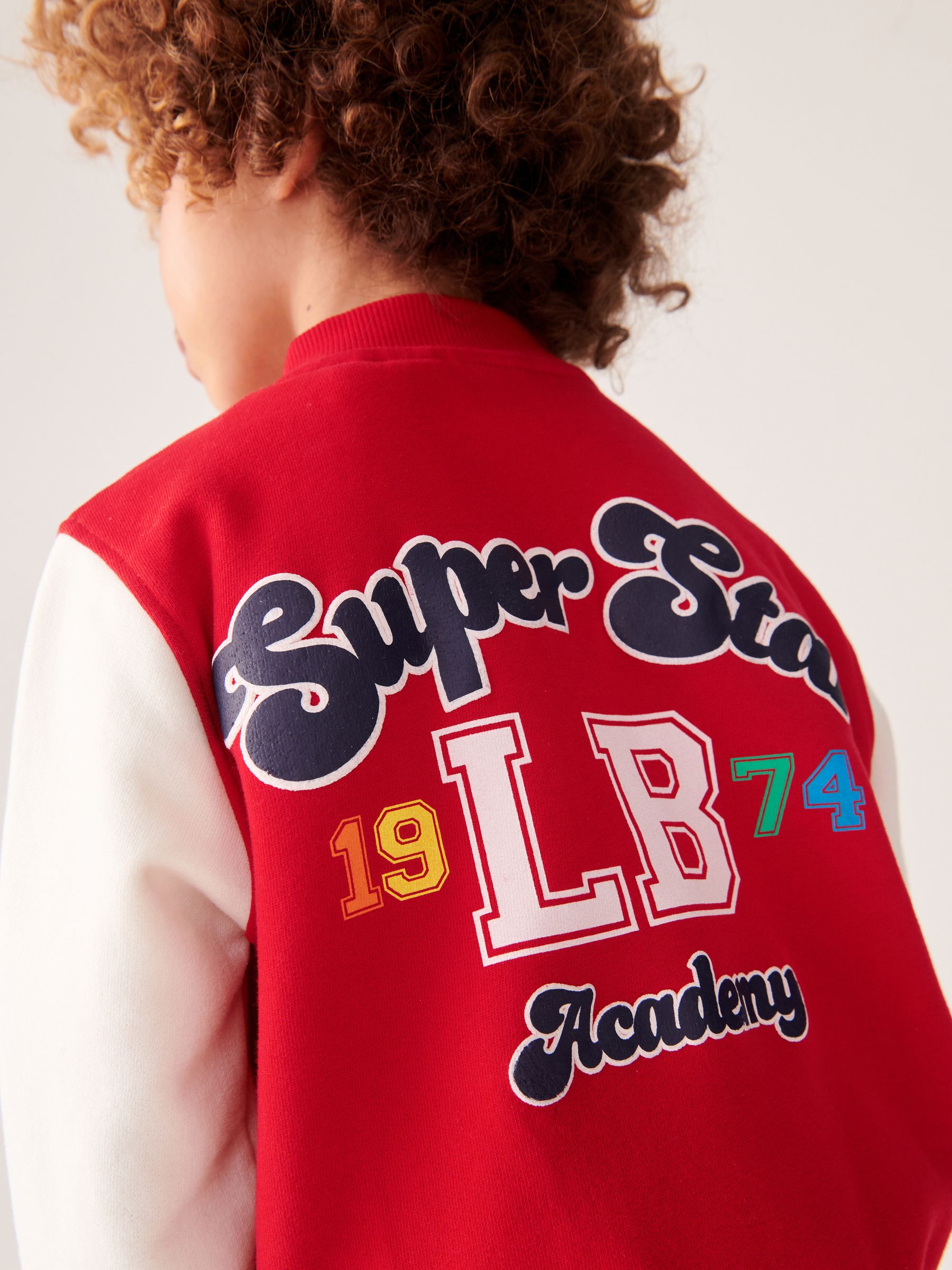 Buy Little Bird by Jools Oliver Red Rainbow Varsity Jacket from Next USA