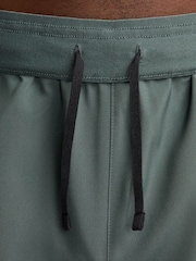 Nike Dark Green 9 Inch Dri-FIT Challenger Unlined Running Shorts - Image 6 of 9
