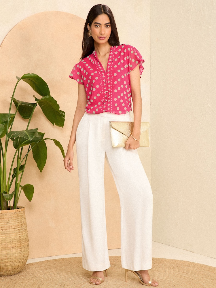 Love & Roses Pink Polka Dot V Neck Flutter Sleeve Blouse - Image 4 of 4 Love & Roses Pink Polka Dot V Neck Flutter Sleeve Blouse - Image 4 of 4