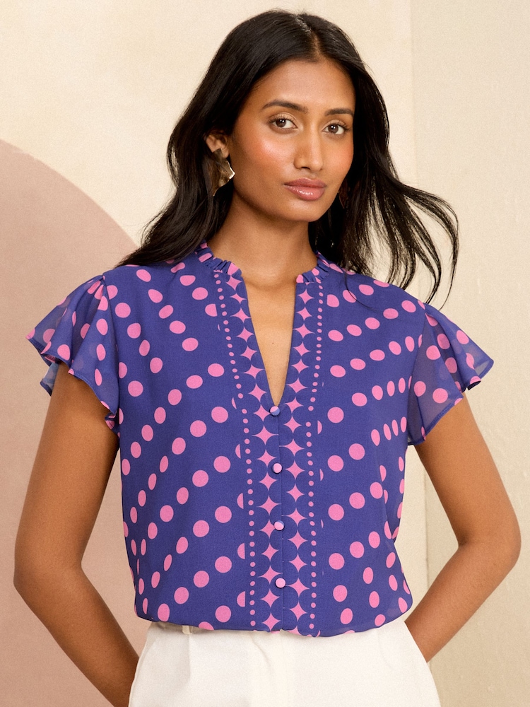 Love & Roses Purple Polka Dot V Neck Flutter Sleeve Blouse - Image 1 of 4