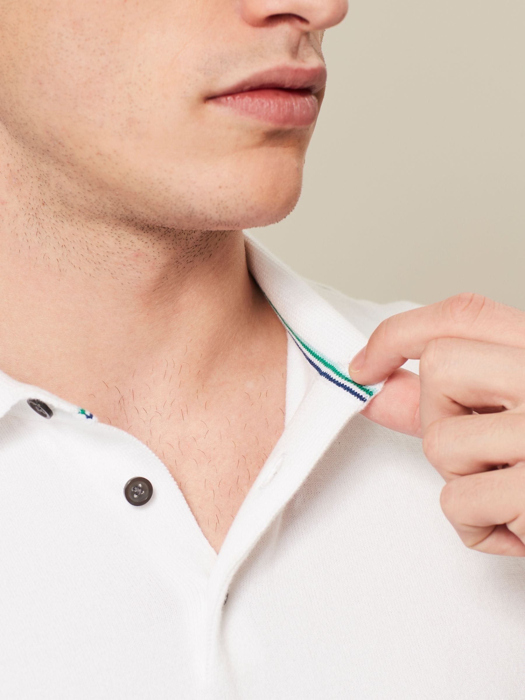 Buy White Slim Fit Cotton Rich Short Sleeve Knit Polo Shirt