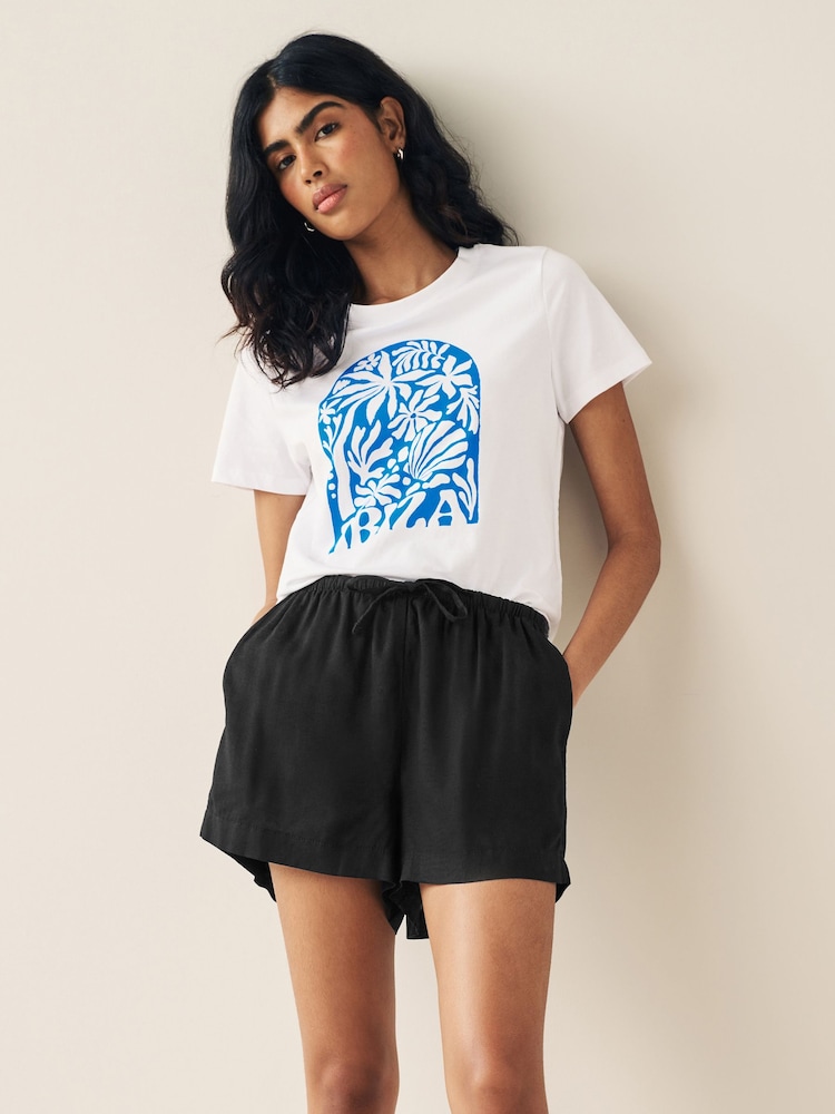 Blau/Weiß - Kurzärmeliges T-Shirt mit Rundhalsausschnitt aus 100 % Baumwolle - Bild 1 von 5