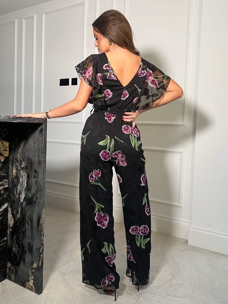Girl In Mind Black Purple Floral Tamara Frilled Jumpsuit - Image 2 of 4 Girl In Mind Black Purple Floral Tamara Frilled Jumpsuit - Image 2 of 4