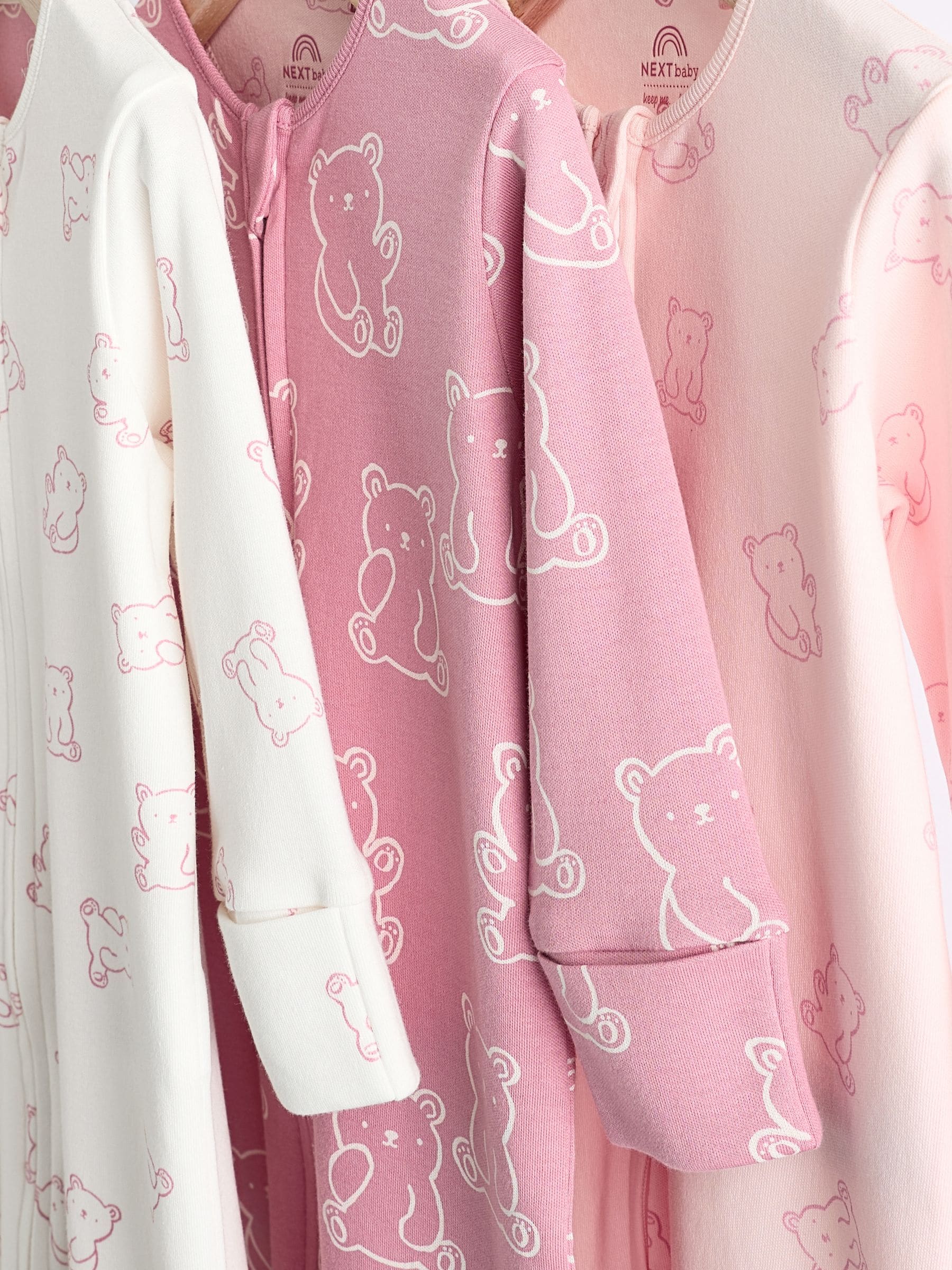 Buy Pink 3 Pack Two Way Zip Baby Sleepsuits (0-2yrs) from the Next