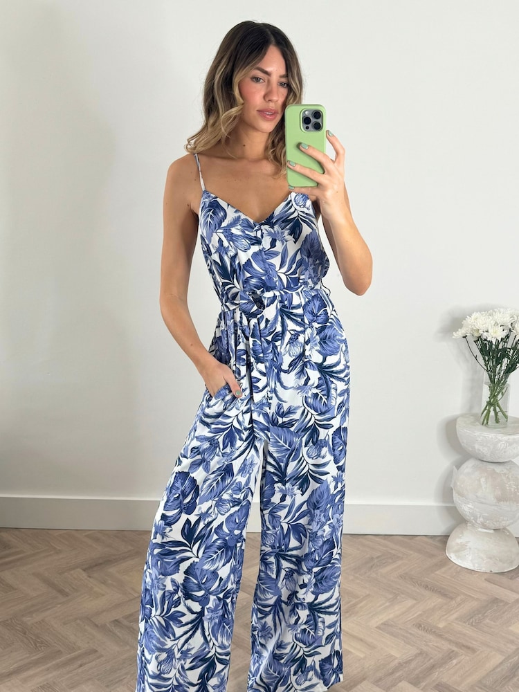 Style Cheat Blue Floral Heather Wide Leg Waist Tie Jumpsuit - Image 1 of 4 Style Cheat Blue Floral Heather Wide Leg Waist Tie Jumpsuit - Image 1 of 4