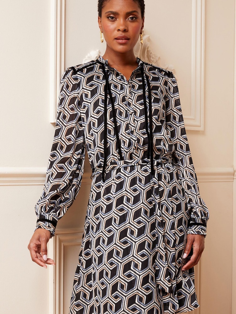 Love & Roses Black Geometric Long Sleeve Tie Neck Chiffon Mini Dress - Image 1 of 4 Love & Roses Black Geometric Long Sleeve Tie Neck Chiffon Mini Dress - Image 1 of 4