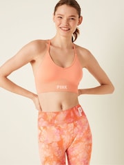 Victoria's Secret PINK Coral Cream Orange Seamless Lightly Lined Low Impact Sports Bra - Image 1 of 4