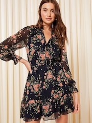 Friends Like These Navy Blue Floral Chiffon Tie Neck Ruffle Hem Mini Dress - Image 1 of 4