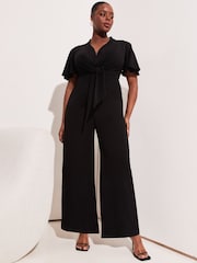 Lipsy Black Curve Flutter Sleeve V Neck Tie Front Wide Leg Jumpsuit - Image 1 of 4