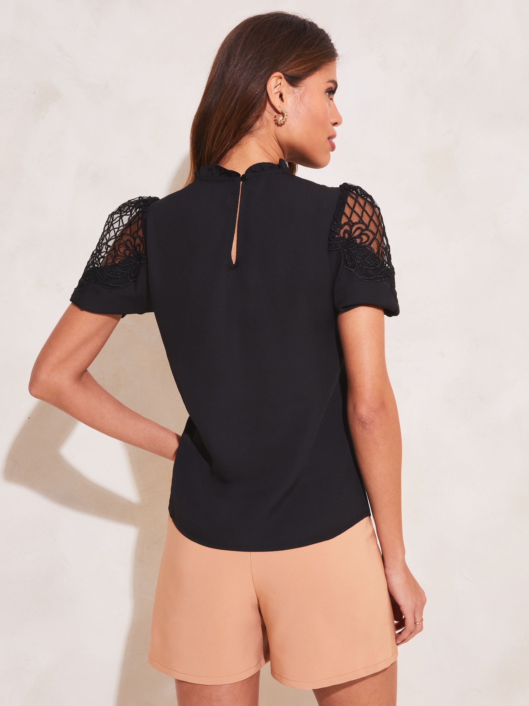 Buy Lipsy Black High Neck Artwork Cut Out Yoke Short Sleeve Top from Next  Luxembourg