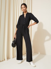 Friends Like These Black Jersey Long Sleeve Cinched Waist Jumpsuit - Image 1 of 4