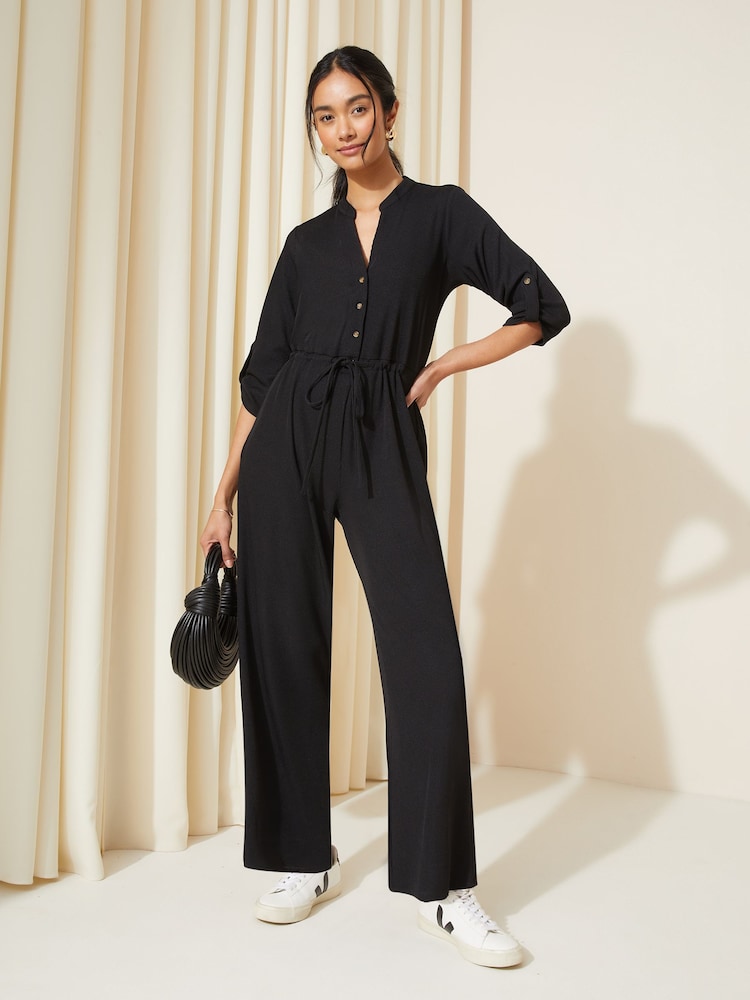Friends Like These Black Jersey Long Sleeve Cinched Waist Jumpsuit - Image 1 of 4