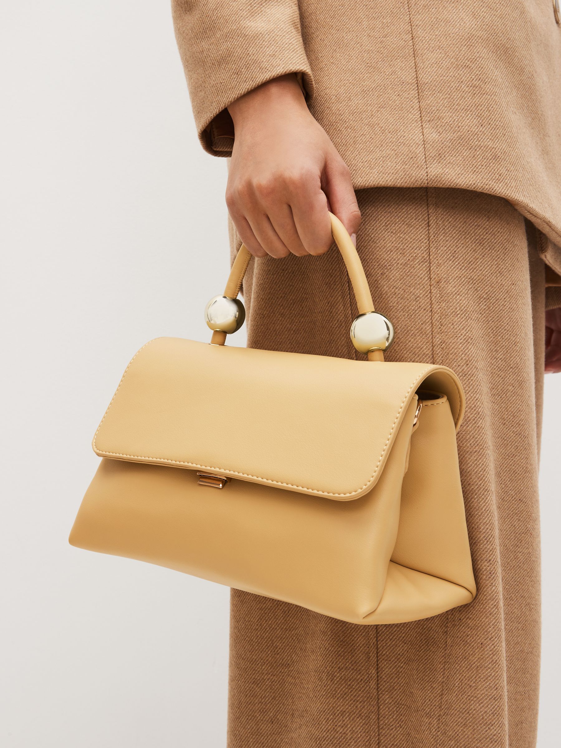 Buy Light Yellow Orb Detail Top Handle Bag from Next Luxembourg