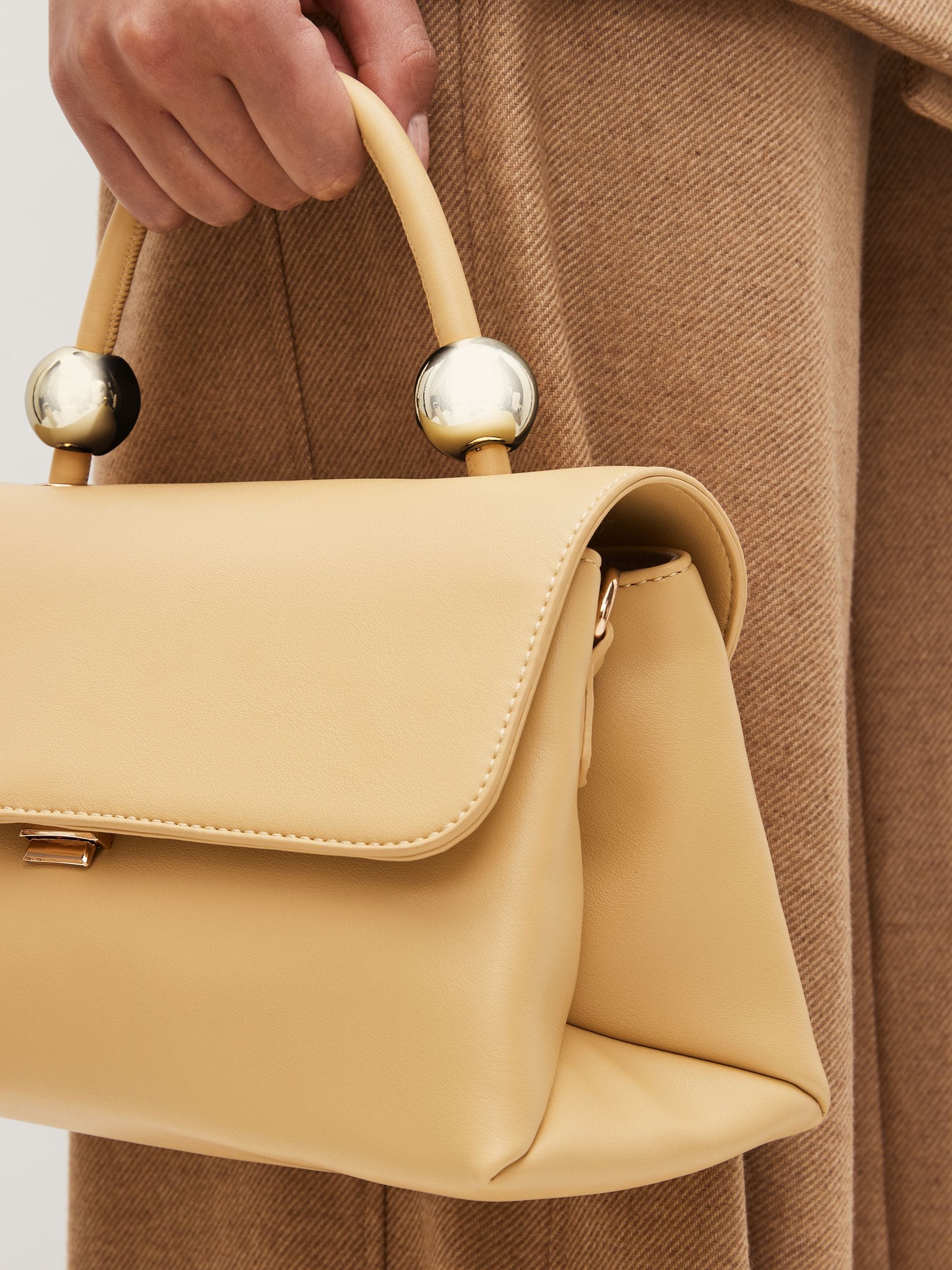 Buy Light Yellow Orb Detail Top Handle Bag from Next Luxembourg
