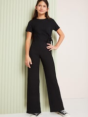 Lipsy Black Tie Side Crinkle Texture Jersey Jumpsuit (5-16yrs) - Image 1 of 2