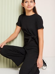 Lipsy Black Tie Side Crinkle Texture Jersey Jumpsuit (5-16yrs) - Image 2 of 2