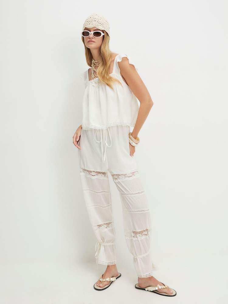 River Island Cream Molly Smith Sleeveless Lace Jumpsuit - Image 1 of 4 River Island Cream Molly Smith Sleeveless Lace Jumpsuit - Image 1 of 4