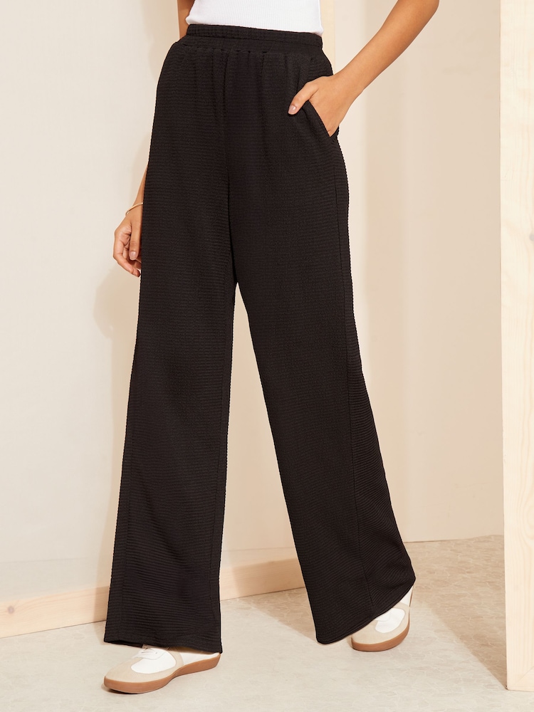 Friends Like These Black Textured Wide Leg Trouser With Elasticated Waist - Image 1 of 4 Friends Like These Black Textured Wide Leg Trouser With Elasticated Waist - Image 1 of 4