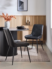Set of 2 Distressed Faux Leather Black Hamilton Black Leg Quilted Dining Chairs - Image 1 of 9