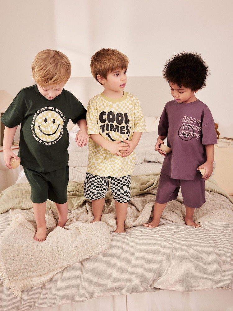 Purple/Green Checkerboard Smile 100% Cotton Short Pyjamas 3 Pack (9mths-8yrs) - Image 1 of 9 Purple/Green Checkerboard Smile 100% Cotton Short Pyjamas 3 Pack (9mths-8yrs) - Image 1 of 9
