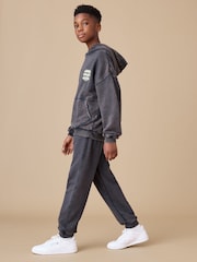 Reebok Boys Washed Logo 100% Cotton Black Joggers - Image 1 of 8