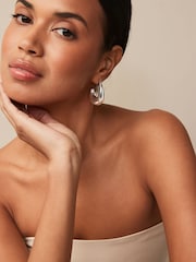 Silver Tone Chunky Oval Hoops Earrings - Image 1 of 3