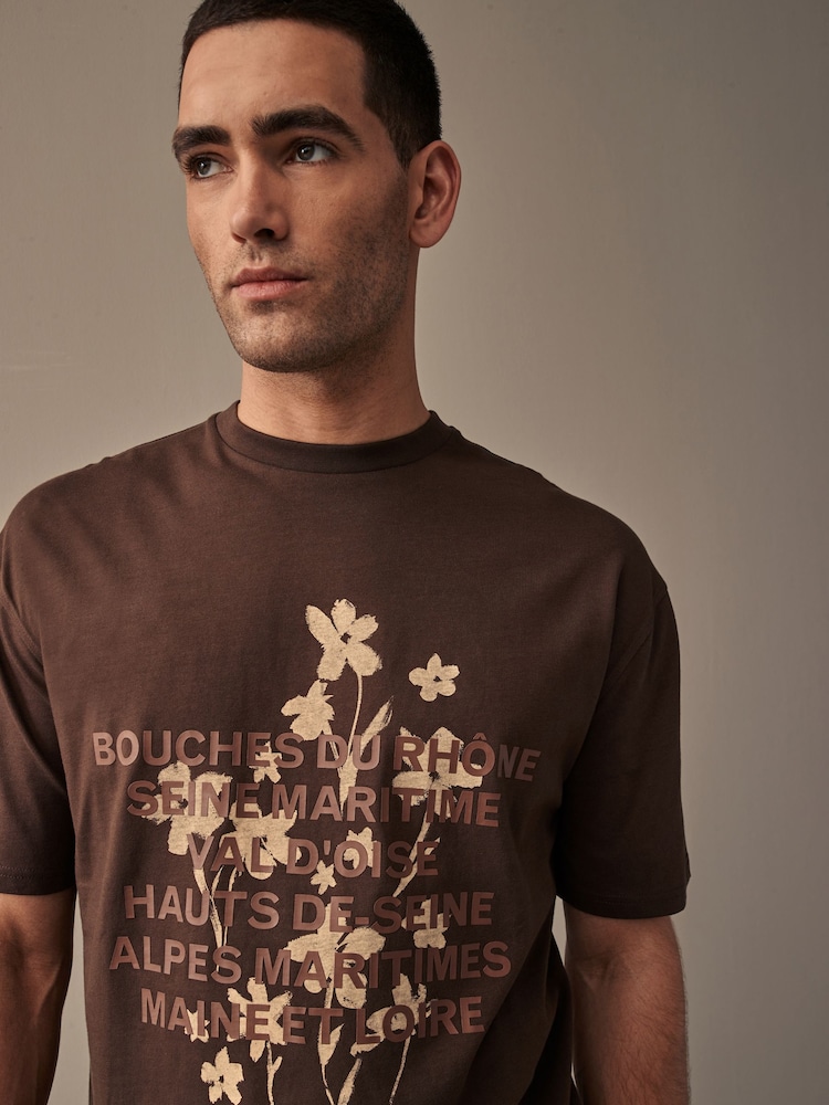 Braun mit Blumenmuster - Bequeme Passform - T-Shirt aus 100 % Baumwolle mit Floralgrafik - Bild 1 von 7