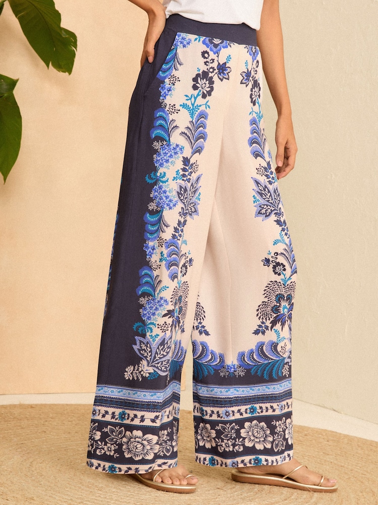 V&A | Love & Roses Blue Placement Print Wide Leg Trousers - Image 1 of 4