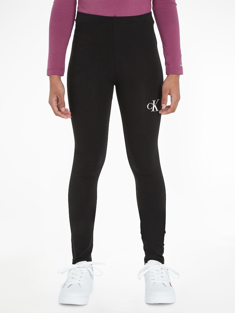 Calvin Klein Jeans Black Monogram Logo Leggings - Image 1 of 6 Calvin Klein Jeans Black Monogram Logo Leggings - Image 1 of 6