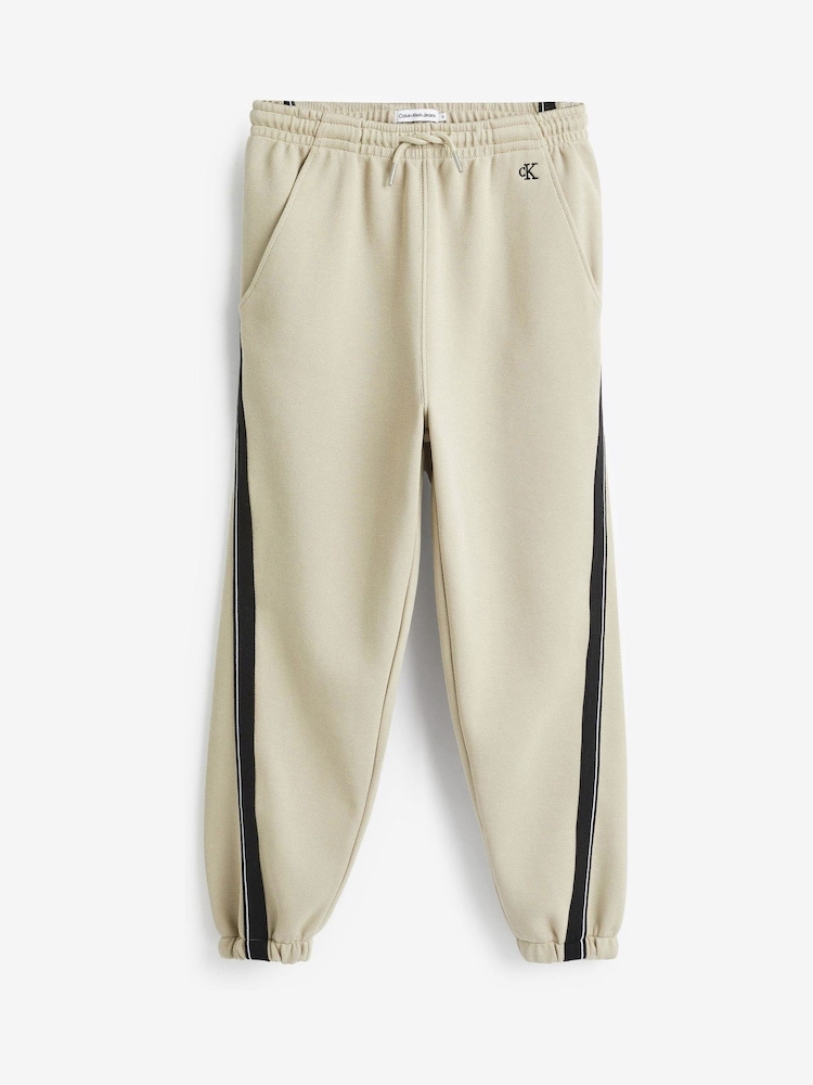 Calvin Klein Jeans Pique Interock Cream Joggers - Image 1 of 5 Calvin Klein Jeans Pique Interock Cream Joggers - Image 1 of 5