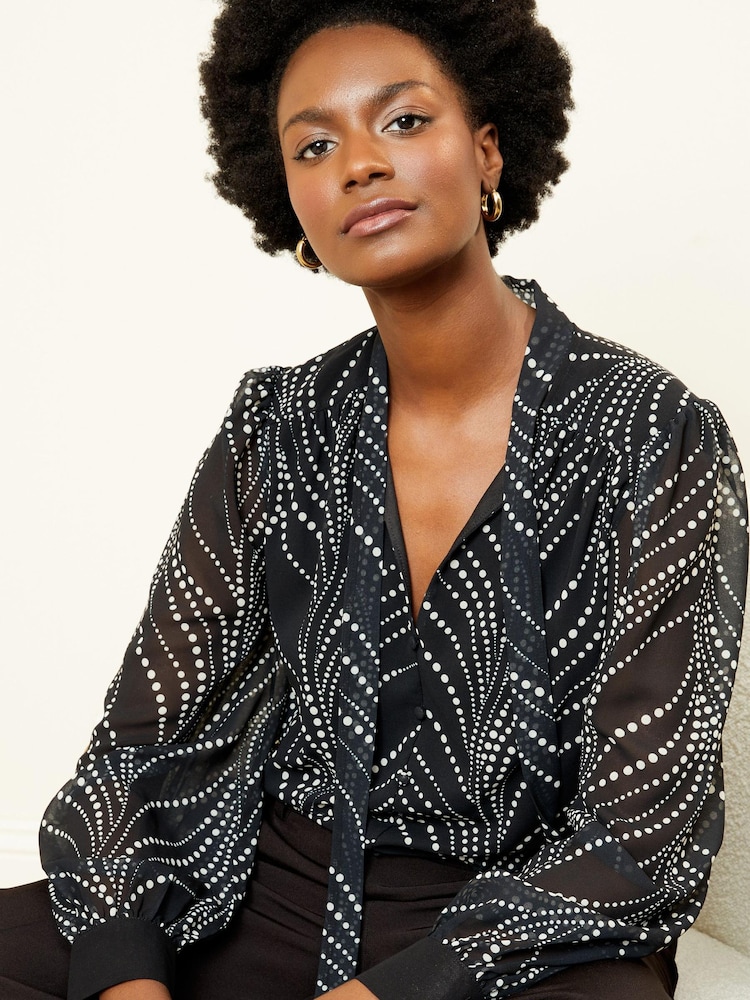 Love & Roses Black Mono Polka Dot Long Sleeve Tie Neck Shirred Cuff Blouse - Image 1 of 4 Love & Roses Black Mono Polka Dot Long Sleeve Tie Neck Shirred Cuff Blouse - Image 1 of 4