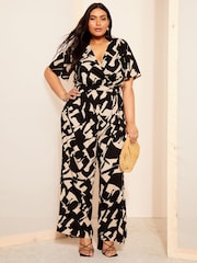 Curves Like These Black/White Flutter Sleeve Wide Leg Jumpsuit - Image 1 of 4