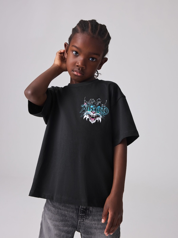 smALLSAINTS Black/Tomkat Boys Oversized Graphic Crew 100% Cotton T-Shirt - Image 1 of 8 smALLSAINTS Black/Tomkat Boys Oversized Graphic Crew 100% Cotton T-Shirt - Image 1 of 8