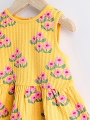 Blumenmuster, Ocker/Gelb - 2-teiliges Baby-Set mit Schößchenoberteil und Höschen aus 100 % Baumwolle - Bild 5 von 8