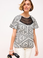 Black/White 100% Cotton Short Sleeve Crochet Bubblehem Printed Top - Image 1 of 6
