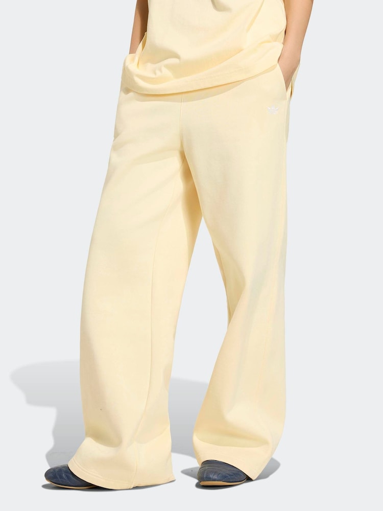 adidas Originals Yellow Essentials Wide Leg Pant Fleece - Image 1 of 6 adidas Originals Yellow Essentials Wide Leg Pant Fleece - Image 1 of 6
